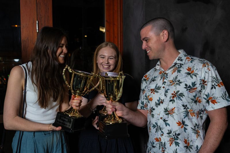 Rhys Everitt from Gympie Web Design toasting with joint Champions Cup winners